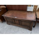 AN OAK BLANKET CHEST WITH LINEN FOLD FRONT