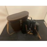 A PAIR OF LEATHER CASED 10X50 FIELD BINOCULARS