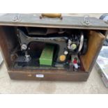 A VINTAGE SINGER SEWING MACHINE IN A CARRY CASE