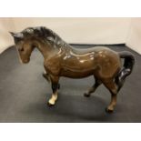 A BESWICK TROTTING HORSE