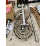 A LARGE QUANTITY OF FIRE HOSE AND VARIOUS HYDRANT FITTINGS