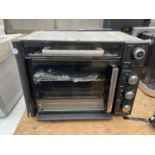 A COOKS ESSENTIAL COUNTERTOP ELECTRIC GRILL OVEN BELIEVED IN WORKING ORDER BUT NO WARRANTY