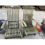 A PAIR OF WOODEN FOLDING GARDEN CHAIRS