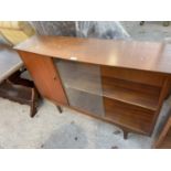A RETRO TEAK BOOKCASE WITH SINGLE DOOR AND TWO SLIDING GLASS DOORS