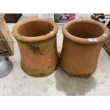 A PAIR OF ROUND CHIMNEY POT TOPS