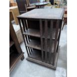 A LATE VICTORIAN OAK REVOLVING BOOKCASE, 20" SQUARE