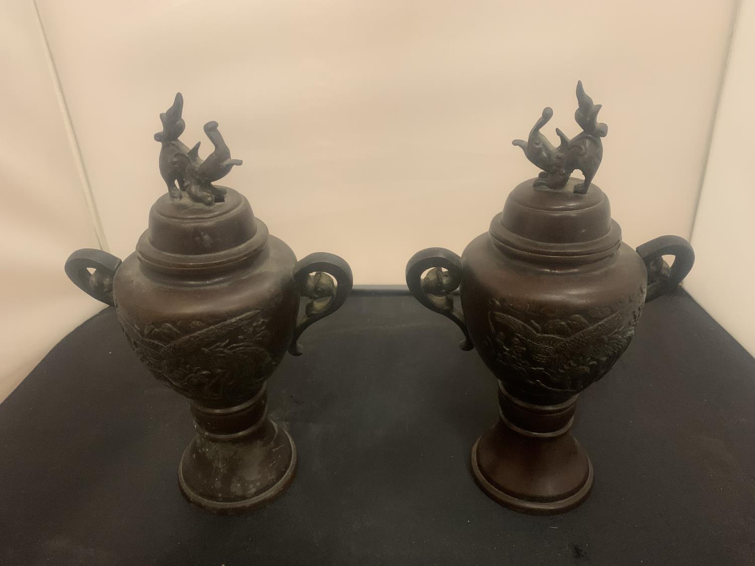 A PAIR OF EARLY BRONZE LIDDED JARS HEIGHT: 26CM