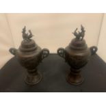 A PAIR OF EARLY BRONZE LIDDED JARS HEIGHT: 26CM