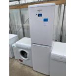 A WHITE BEKO UPRIGHT FRIDGE FREEZER BELIEVED IN WORKING ORDER BUT NO WARRANTY