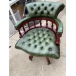 A GREEN LEATHER CHESTERFIELD CAPTAINS SWIVEL DESK ARMCHAIR