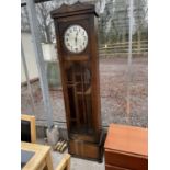 AN EARLY 20TH CENTURY OAK HALL LONGCASE CLOCK WITH GLASS DOOR AND THREE WEIGHTS