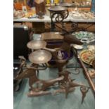 THREE SCANDINAVIAN STYLE BLACKSMITH CRAFTED REINDEER THE LARGER EXAMPLES WITH CANDLE HOLDERS