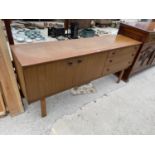 A RETRO TEAK SCHREIBER SIDEBOARD ON OPEN BASE, ENCLOSING THREE DRAWERS AND TWO CUPBOARDS, 69" WIDE