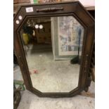 AN OAK FRAMED MIRROR