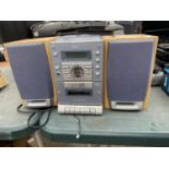 A SANYO MINI HI-FI SYSTEM WITH TWO SPEAKERS BELIEVED IN WORKING ORDER BUT NO WARRANTY