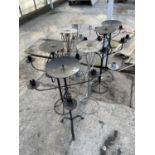 A LARGE QUANTITY OF DECORATIVE METAL FOUR BRANCH CANDLE HOLDERS