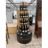 A CIRCULAR THREE TIER MOET AND CHANDON CAMPAGNE ILLUMINATED DISPLAY OF BOTTLE