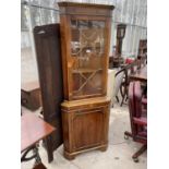 A MODERN YEW WOOD CORNER CUPBOARD