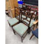 FOUR CARVED OAK DINING CHAIRS