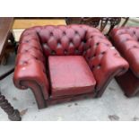 AN OXBLOOD LEATHER LOW BUTTON BACK CHESTERFIELD ARMCHAIR