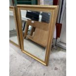 A MODERN GILT FRAMED WALL MIRROR 29.5x42"