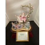 A WEDGEWOOD FIGURINE - LADY ON A SWING BY RENAISSANCE DESIGN STUDIO LTD LIMITED EDITION 7/100 WITH