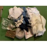 A QUANTITY OF VINTAGE GLOVES HATS AND TABLE CLOTHS ETC