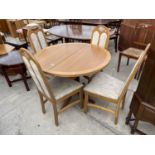 A MODERN CIRCULAR OAK EXTENDING DINING TABLE AND FOUR CHAIRS, 39" DIAMETER