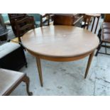 A CIRCULAR RETRO G-PLAN EXTENDING DINING TABLE, 48" DIAMETER, EXTRA LAF 18"