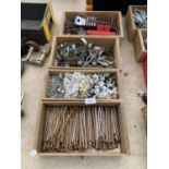 FOUR WOODEN STORAGE BOXES CONTAINING A LARGE QUANTITY OF HARD WARE ITEMS TO INCLUDE NAILS, TACKS AND
