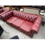 AN OXBLOOD LEATHER LOW BUTTON BACK CHESTERFIELD THREE SEATER SOFA