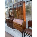 AN EARLY 20TH CENTURY MAHOGANY BUREAU BOOKCASE ON CABRIOLE LEGS WITH BALL AND CLAW FEET, 35" WIDE