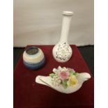 THREE ROYAL DOULTON ITEMS TO INCLUDE A SMALL BLUE FLAMBE VASE, A BUD VASE AND A DOVE WITH FLOWERS