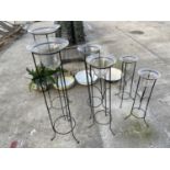 SIX VARIOUS SIZED GLASS PLANTERS WITH METAL PEDASTEL BASES