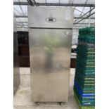 A LARGE STAINLESS STEEL CATERING FRIDGE