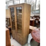 A MODERN GLAZED TWO DOOR DISPLAY CABINET WITH FOUR DRAWERS TO BASE, 37.5" WIDE