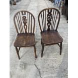 A PAIR OF WINDSOR STYLE WHEELBACK CHAIRS