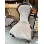 A VICTORIAN WALNUT NURSING CHAIR