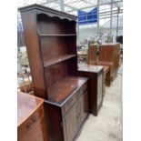 A REPRODUCTION DRESSER AND STEREO CABINET