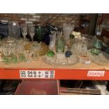 A LARGE QUANTITY OF GLASSWARE TO INCLUDE CUT AND COLOURED GLASS ETC