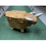A SMALL T-REX CHILD'S FOOTSTOOL