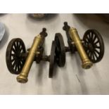 A PAIR OF BRASS AND CAST IRON CANNONS