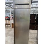 A LARGE STAINLESS STEEL CATERING FRIDGE