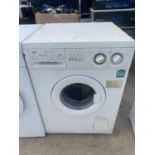 A WHITE ZANUSSI QUICK N CLEAN WASHING MACHINE BELIEVED IN WORKING ORDER BUT NO WARRANTY