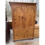 A MODERN PINE WARDROBE WITH FOUR DRAWERS TO THE BASE, 51" WIDE