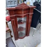 AN ITALIAN STYLE BOW FRONTED CORNER CABINET
