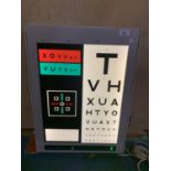 A VINTAGE ELECTRONIC EYESIGHT TESTER BELIEVED IN WORKING ORDER BUT NO WARRANTY
