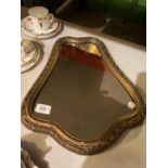 A SMALL GILT FRAMED MIRROR