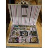 A STACKERS JEWELLERY BOX CONTAINING A SELECTION OF COSTUME JEWELLERY