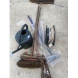 AN ASSORTMENT OF GARDEN TOOLS TO INCLUDE PICK AXE, BRUSHES AND EXTENSION LEAD ETC